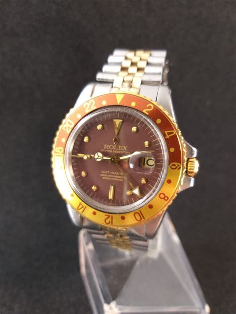 rolex occhio di tigre 1675 red beer|Vintage Rolex Root Beer GMT.